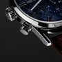 "Naturalist" wristwatch featuring a marble dial and silver accents with a sleek, modern design.