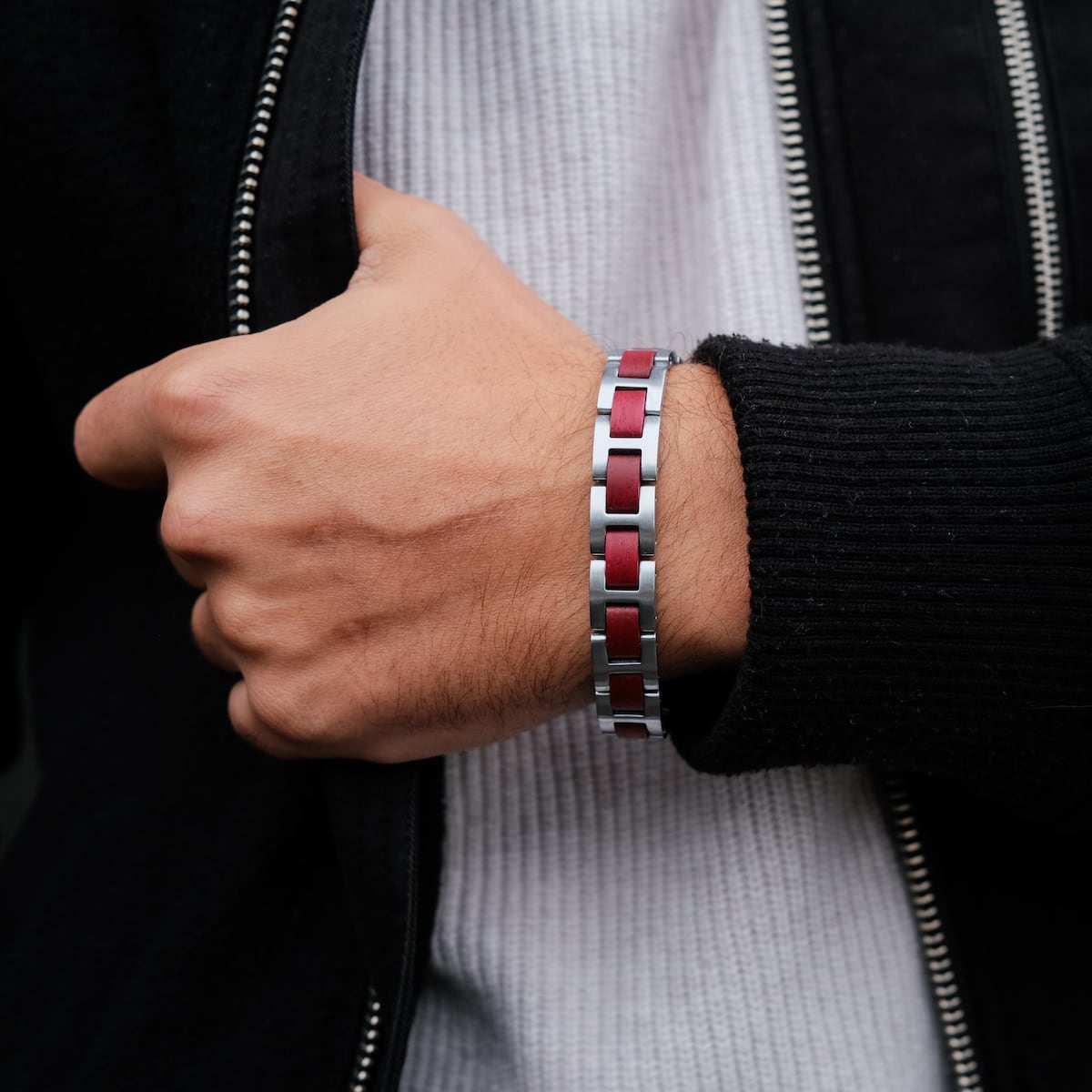 "Acoustic" bracelet features an amaranth and silver design with a sleek, modern style.