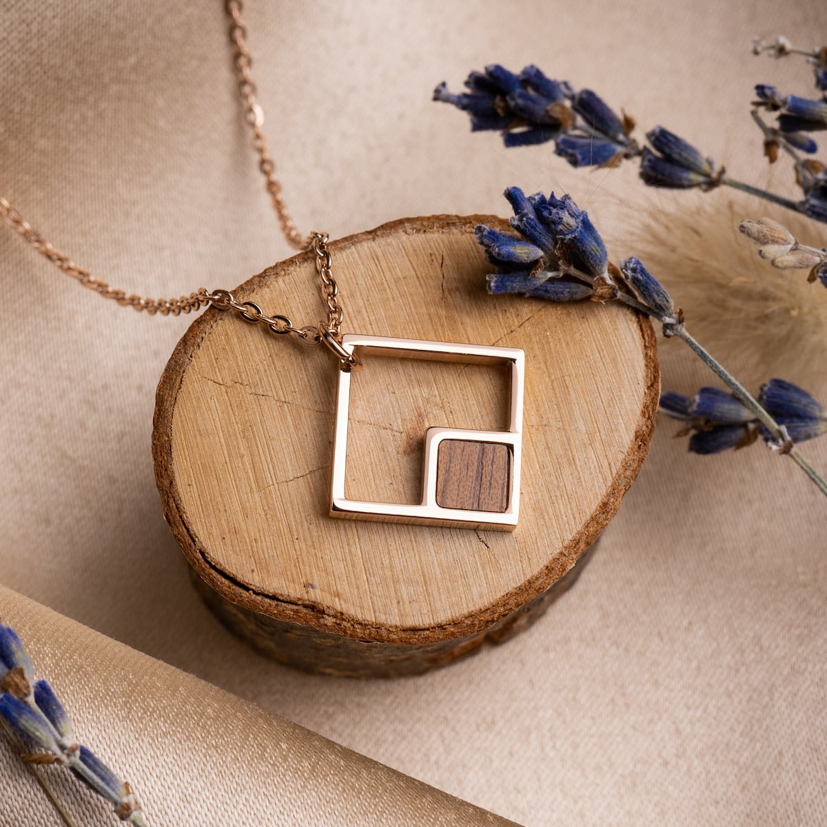 "Geometric Necklace" necklace features a geometric, modern design in walnut and rose gold.