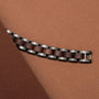 Bracelet de montre "Triad" en noyer et gris, présentant un design moderne et élégant avec des accents en bois riches.